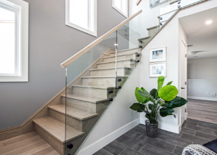 What are the advantages of glass banisters over traditional banisters?